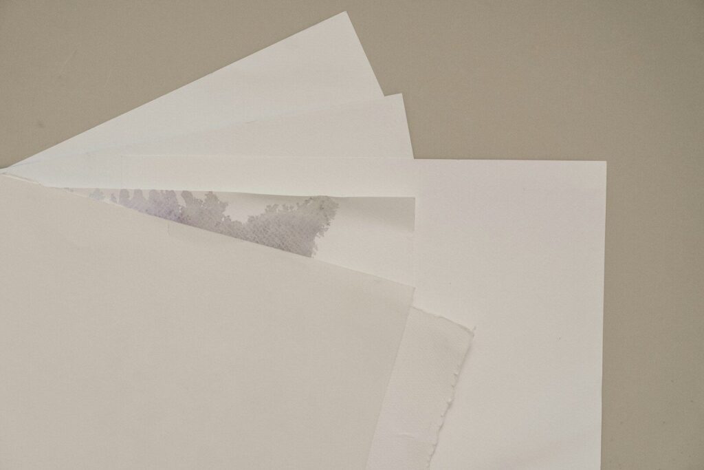 A pile of white paper sitting on top of a table